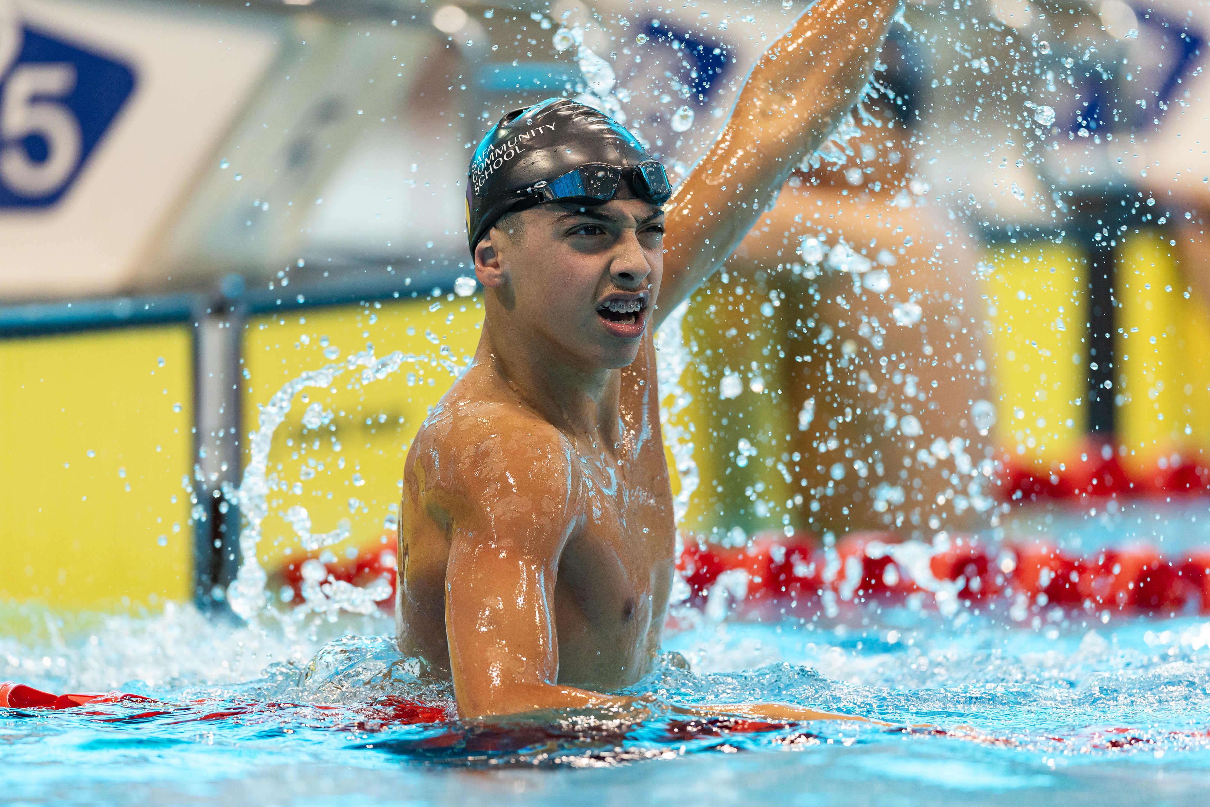 Swimmer celebrating at the wall