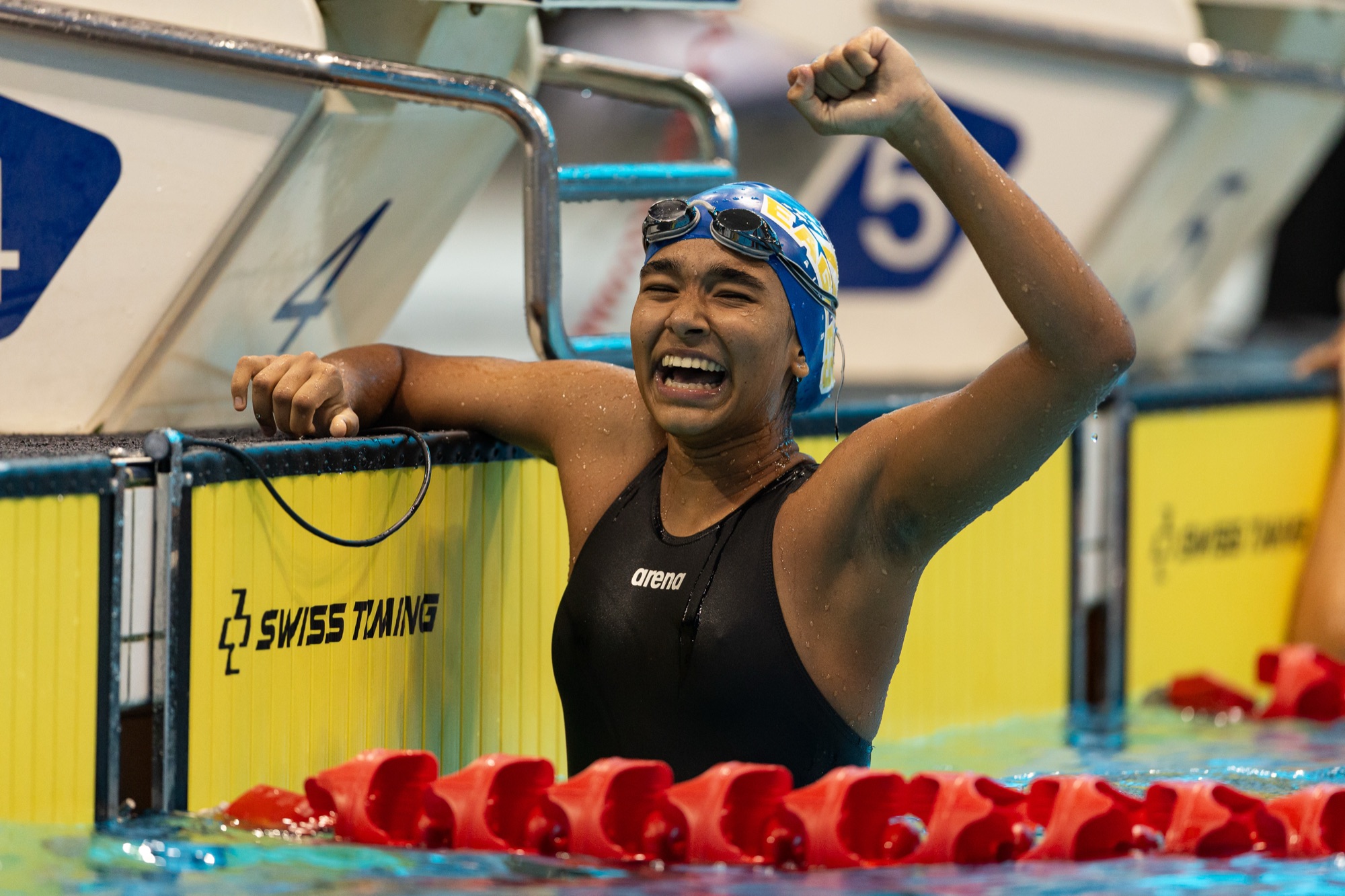 Swimmer celebrating winning a race